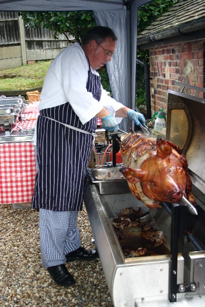 ../Images/Peter, the chef trimming the hog!.jpg